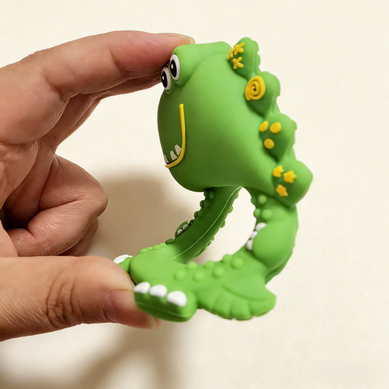 dinosaur baby teething rattle toy made of food grade silicone, safe for chewing, easy grip design, suitable for babies 3 months+