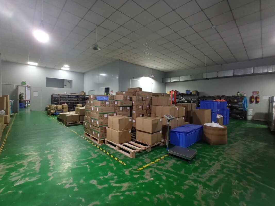 Wide view of Yikang silicone products warehouse showing large-scale storage